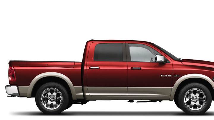 Side Pose Of Dodge Ram 1500 Laramie 2009 In Red N White Background